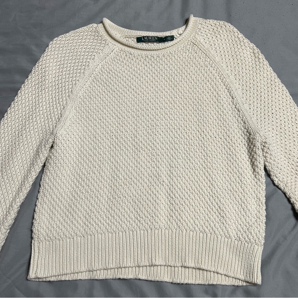Medium women’s sweater. Runs a little small. Fits a small or x-small.